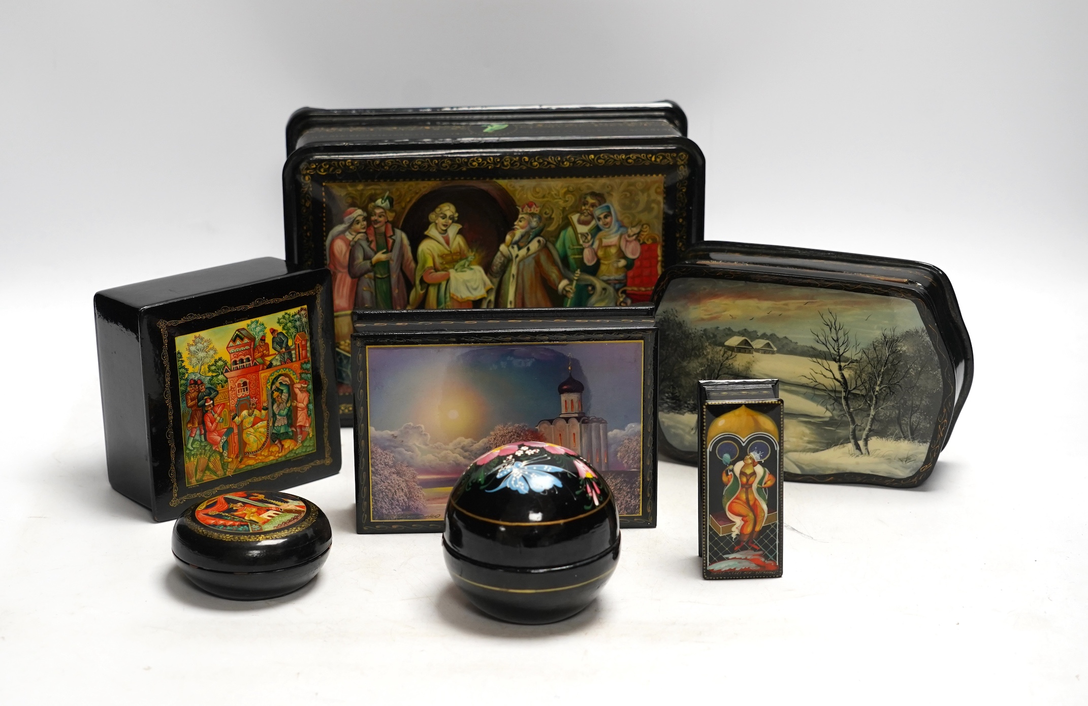 Seven Russian lacquer boxes, largest 21.5cm wide